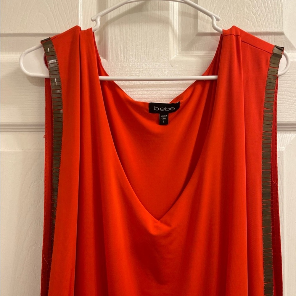 Bebe dress.  Like new. Only worn once. Burnt orange color good for early fall.